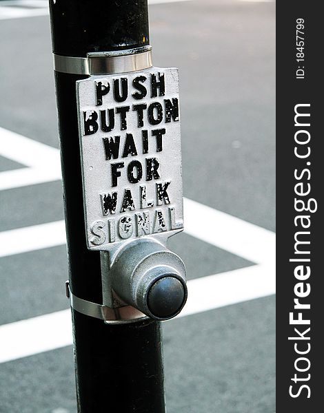 Push button to cross the street. Push button to cross the street.