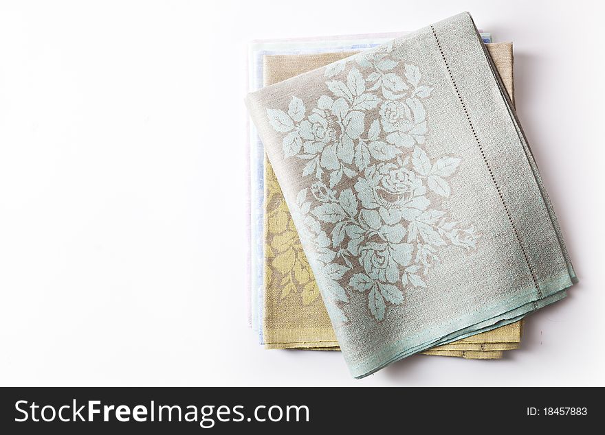 A stack of colored towels. isolated on a white background