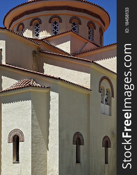 Traditional architecture of greek orthodox church at sunny summer day.