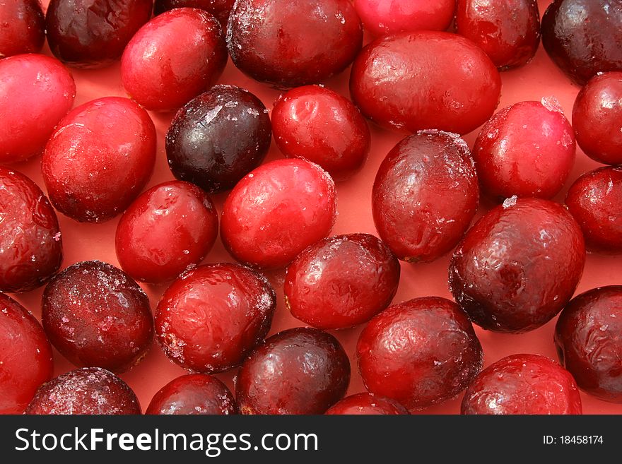 Background of a large frozen ripe cranberries. Background of a large frozen ripe cranberries