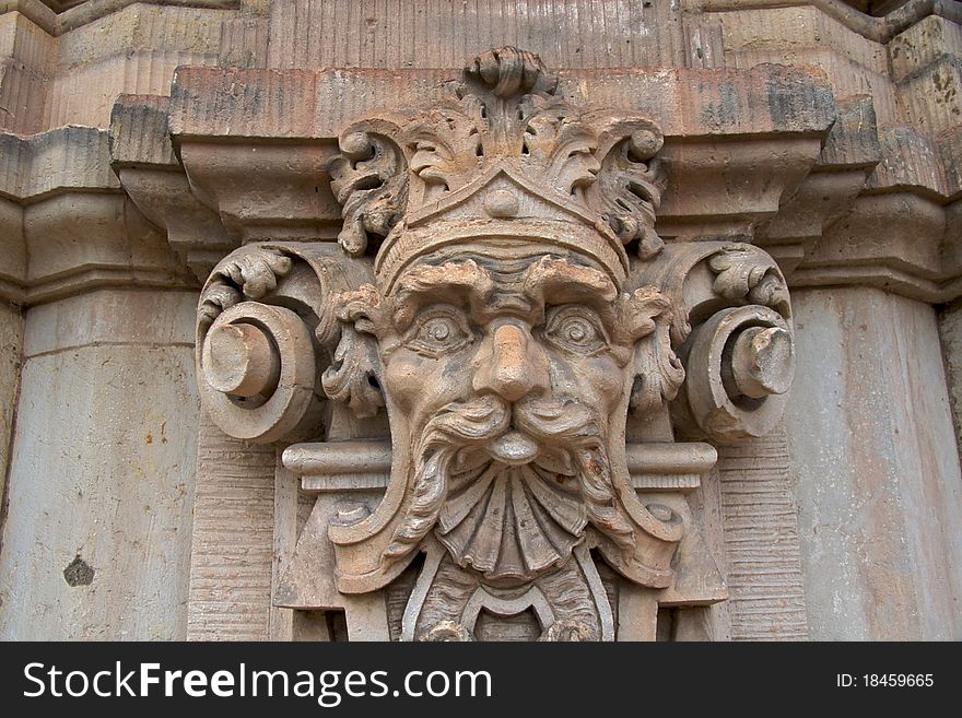 Close-up of one of the numerous sculptured mythological figures on the Wallpavillion of the Zwinger Palace, Dresden. Close-up of one of the numerous sculptured mythological figures on the Wallpavillion of the Zwinger Palace, Dresden