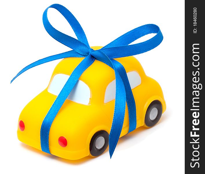 Toy car tied a blue ribbon a simbol of purchase
