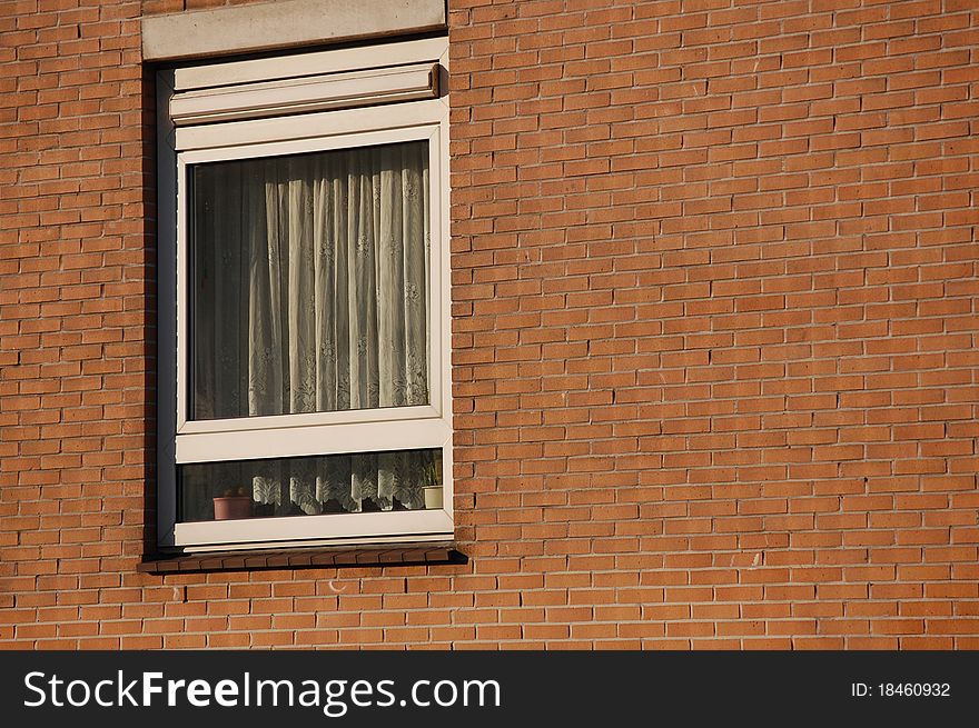 A Window With A Brick Wall