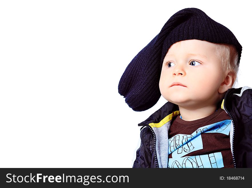 Beautiful little boy. Shot in a studio. Isolated over white background.
