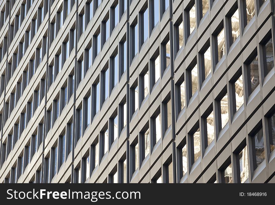 Detail of a modern steel and glass office building. Detail of a modern steel and glass office building