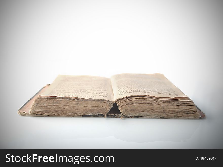 Isolated old open thick book