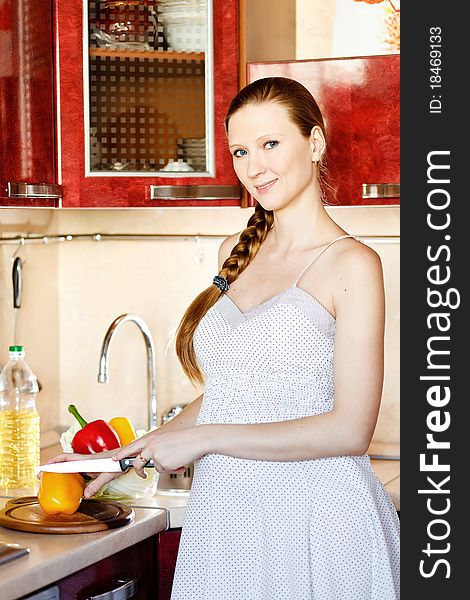 Pregnant Woman In Kitchen