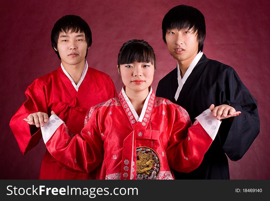 Asian traditional couple on the red background.