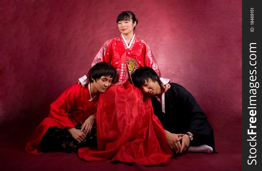 Asian traditional couple on the red background.