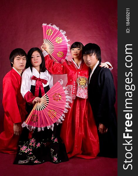 Asian traditional couple on the red background.