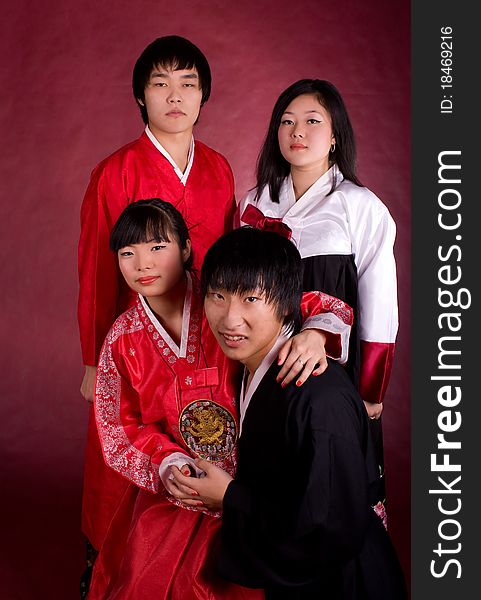 Asian traditional couple on the red background.