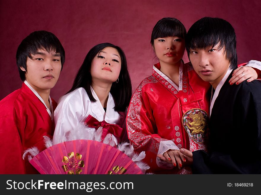 Asian traditional couple on the red background.