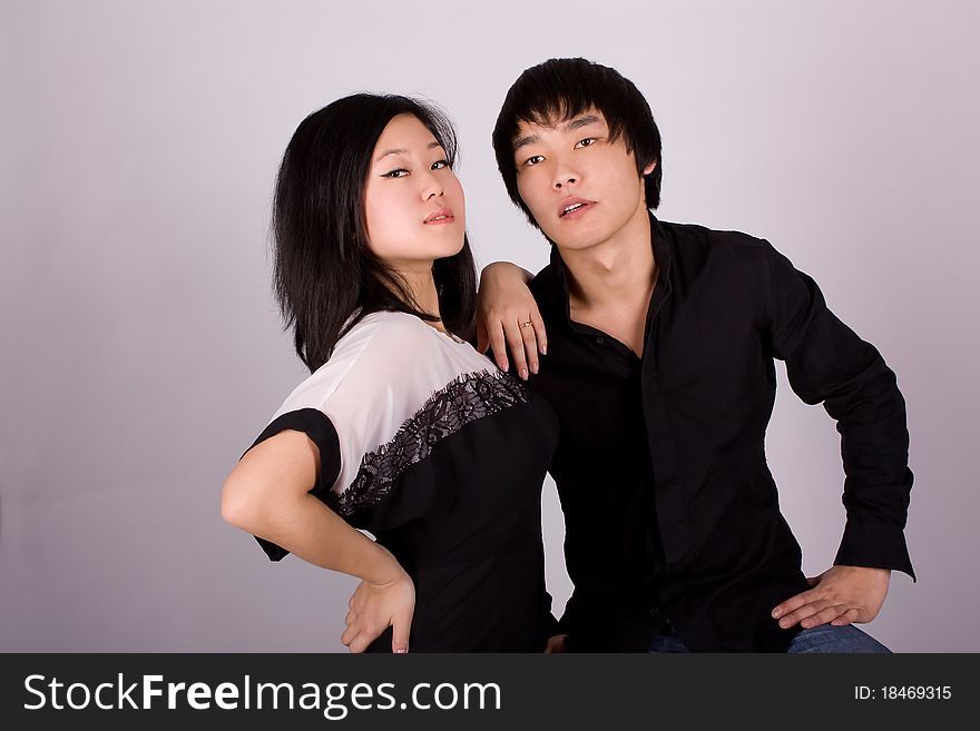 Beautiful asian loving couple in a studio.