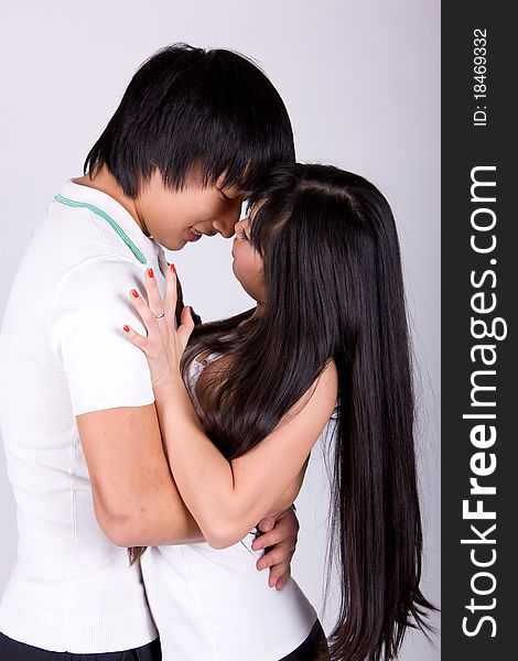 Beautiful asian loving couple in a studio.