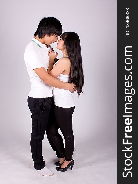 Beautiful asian loving couple in a studio.