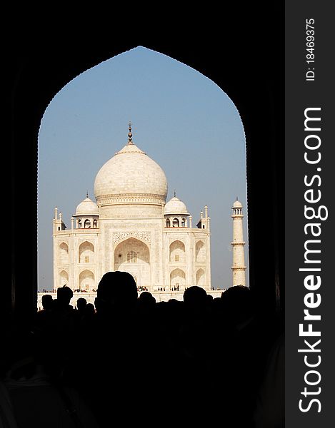 The Taj Mahal seen through an entrance gate. The Taj Mahal seen through an entrance gate