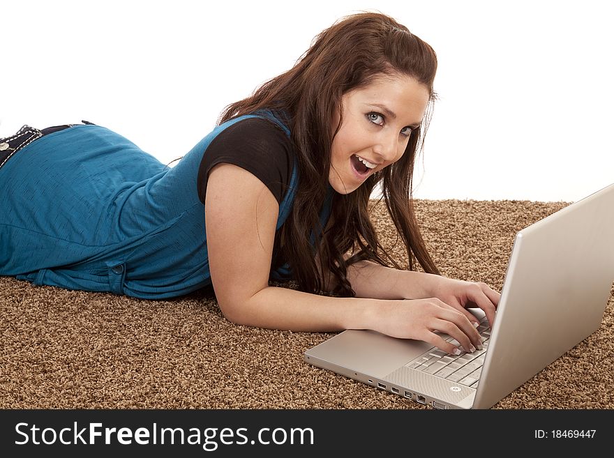 A woman is at her laptop with an excited expression on her face. A woman is at her laptop with an excited expression on her face.