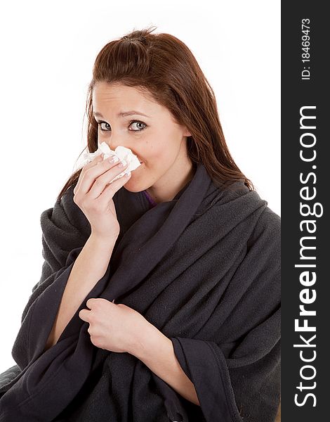 Woman in blanket with tissue