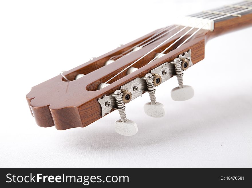 Guitar with the strings on a white background