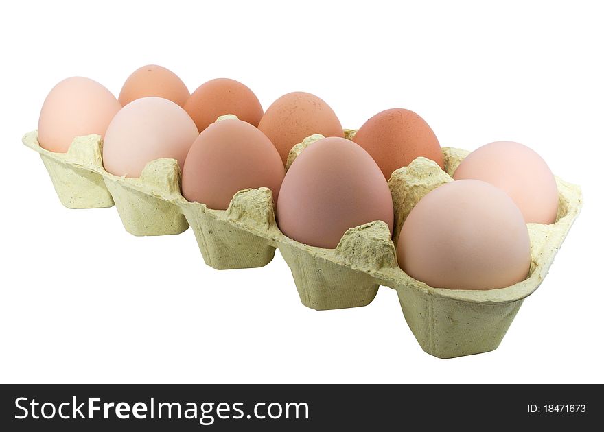A carton of ten eggs isolated on white background. Clipping path include. A carton of ten eggs isolated on white background. Clipping path include.
