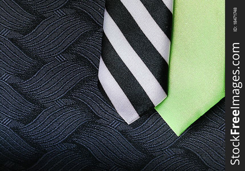 Lime Green and Striped Silk Ties on Black Textured Vest. Lime Green and Striped Silk Ties on Black Textured Vest.