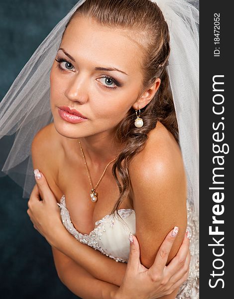 Portrait of the beautiful bride in studio