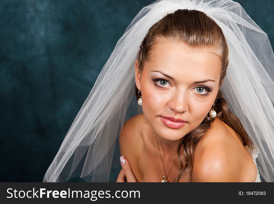 Portrait of the beautiful bride in studio