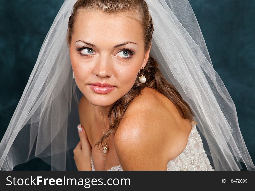 Portrait of the beautiful bride in studio