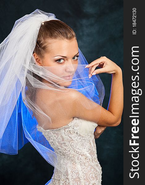 Portrait of the beautiful bride in studio