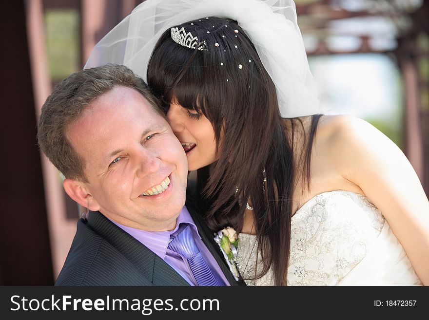 Beautiful bride and loving groom. Beautiful bride and loving groom