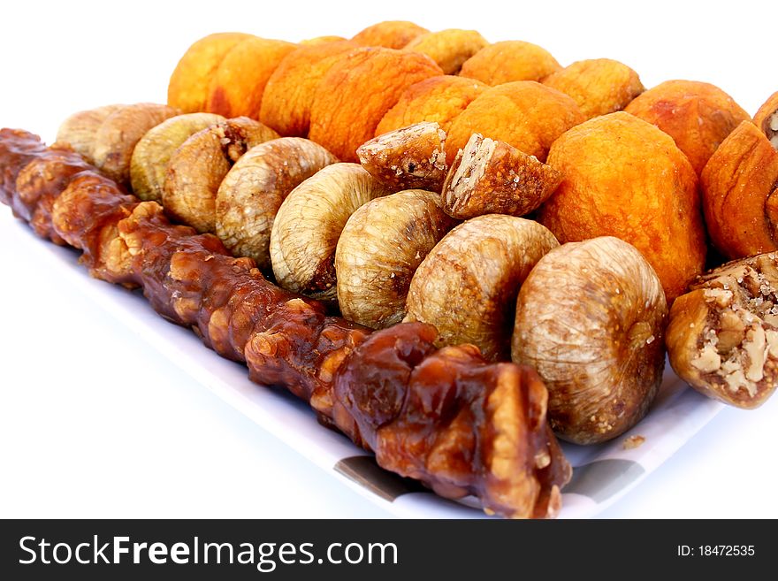 Dried fruits in tray  isolated on white background.