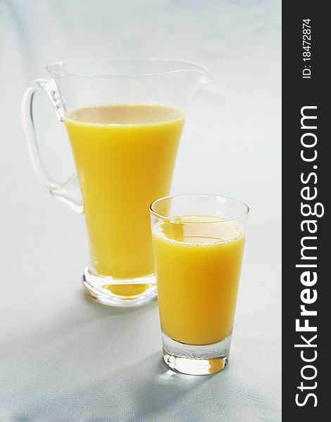 Orange Juice in Glass and Pitcher