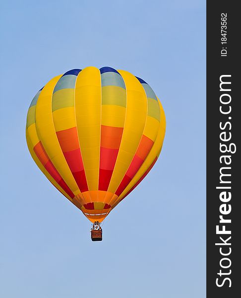 Colorful hot air balloon in blue sky