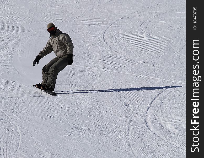 Snowboarder guy on the ski slope