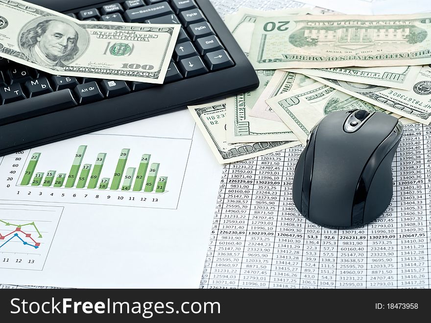 Black keyboard, mouse and dollars on a stock chart. Black keyboard, mouse and dollars on a stock chart