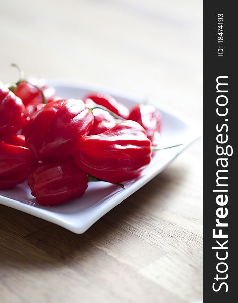 Red hot chili peppers on white plate