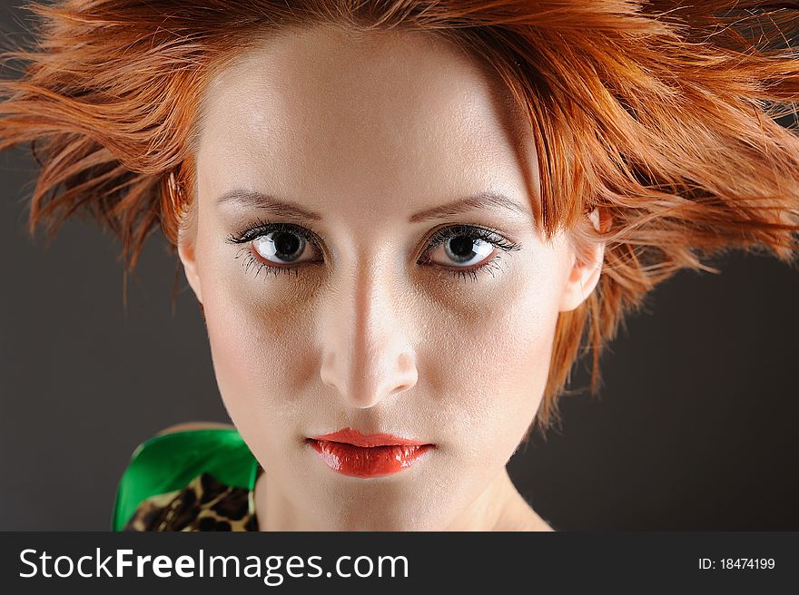 Beauty portrait of pretty woman with healthy red flying hair, pure skin and natural make-up. copy-space. Beauty portrait of pretty woman with healthy red flying hair, pure skin and natural make-up. copy-space