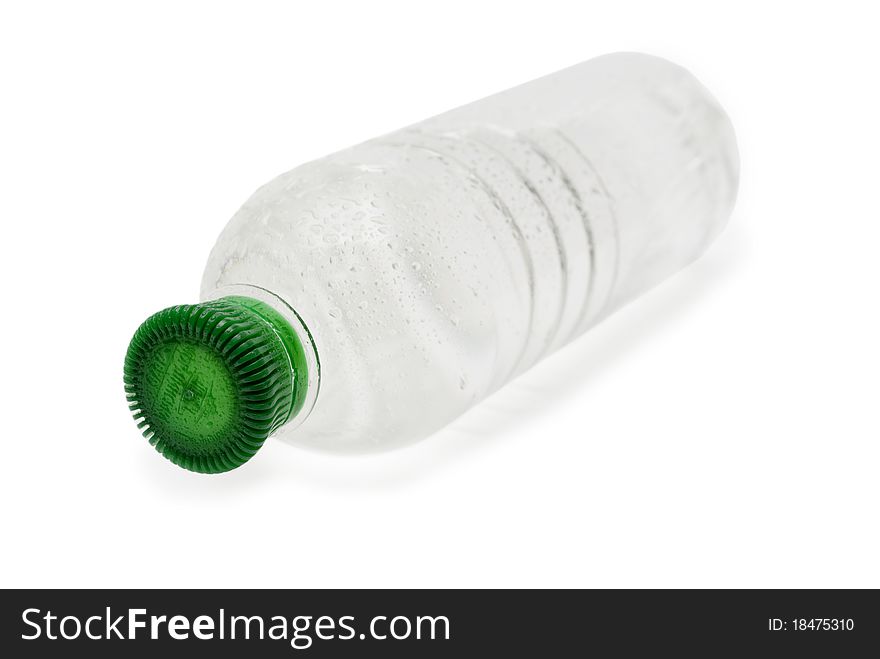 Water in a plastic bottle on a white background. Water in a plastic bottle on a white background