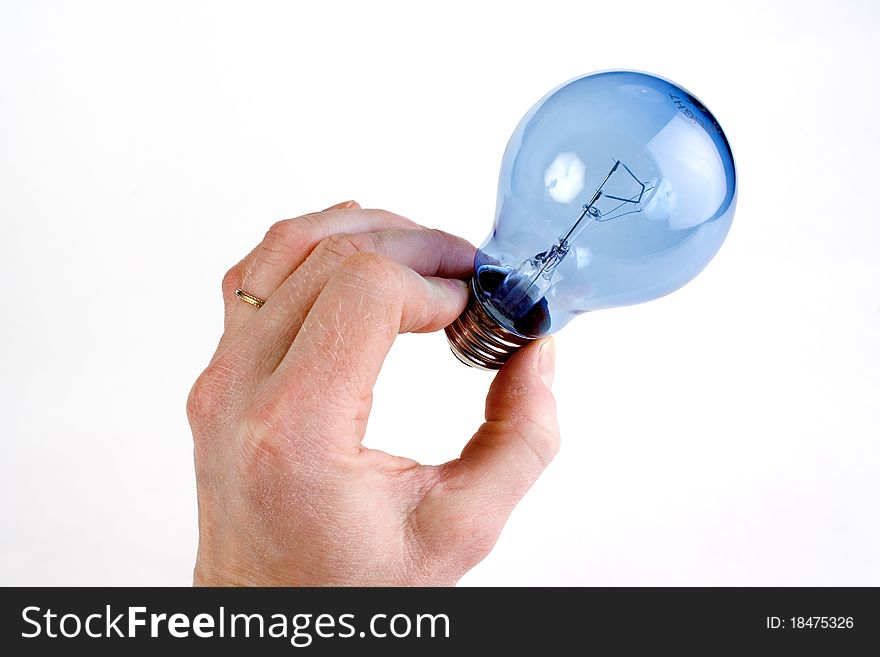 Photo from a hand holding a daylight light bulb. Isolated white background.