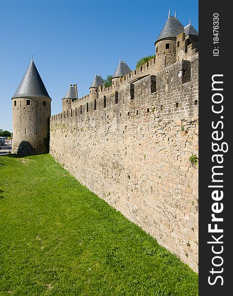 Carcassone is a fortified chateau in Aude south france. This showed tower,stone wall and moat. Carcassone is a fortified chateau in Aude south france. This showed tower,stone wall and moat.