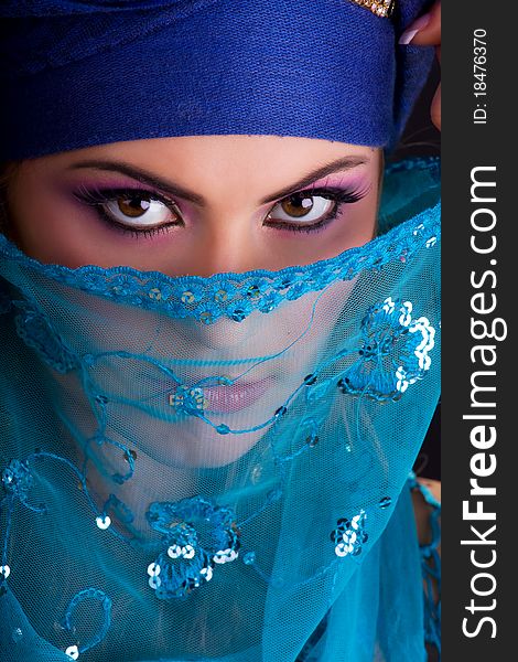 Beautiful girl in the stylized ethnic turban and veil