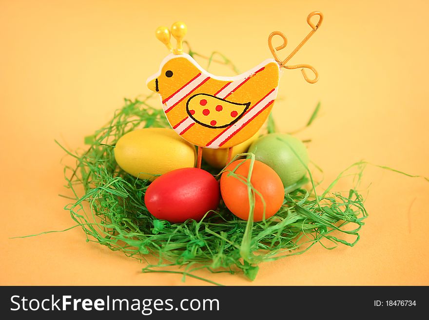 Easter chicken with colored eggs