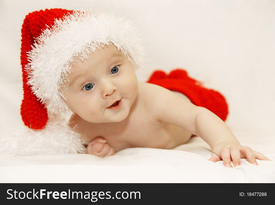 The baby in a cap of Santa. The baby in a cap of Santa