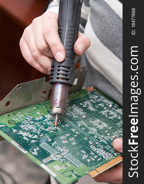 View of a circuit board being repaired