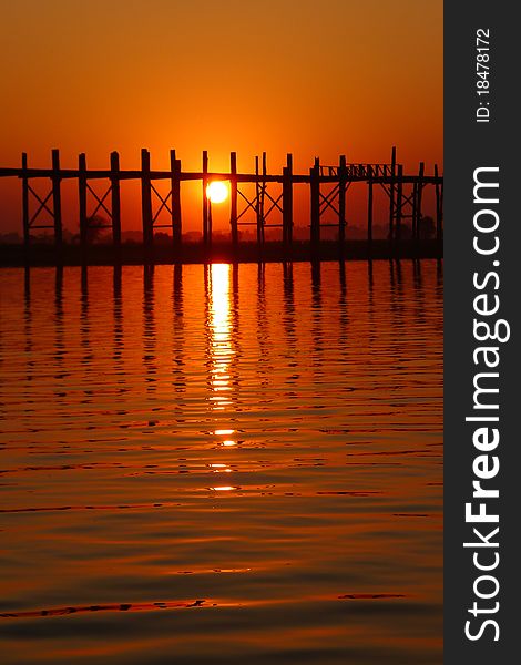 Landscape of a famous old wooden bridge in Myanmar at sunset. Landscape of a famous old wooden bridge in Myanmar at sunset.