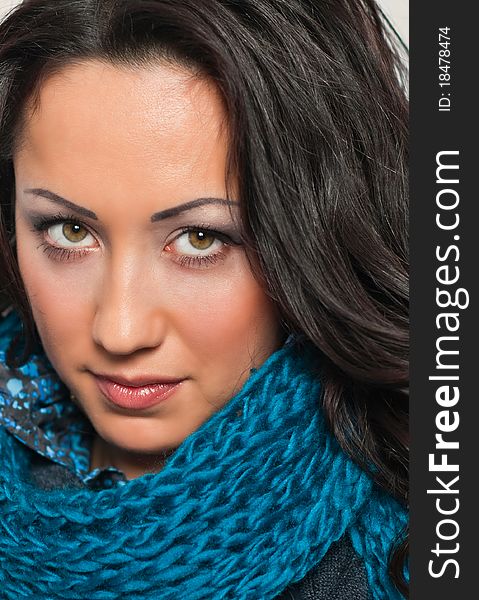 Pretty young brunet portrait in blue scarf. Pretty young brunet portrait in blue scarf