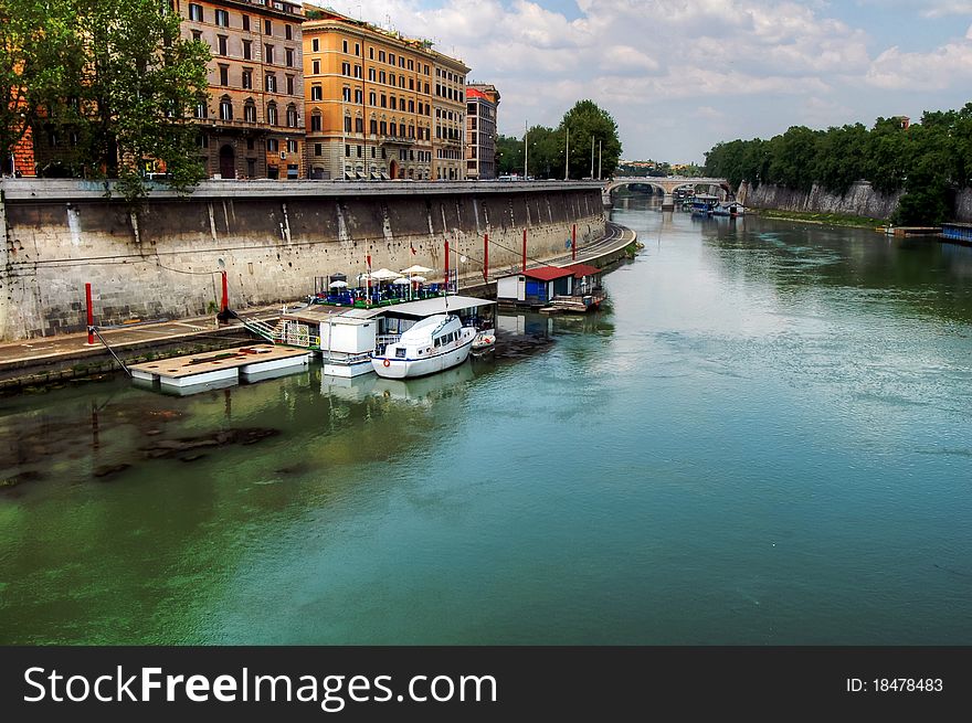 Houseboats and boats on the Tiber in Rome. Houseboats and boats on the Tiber in Rome