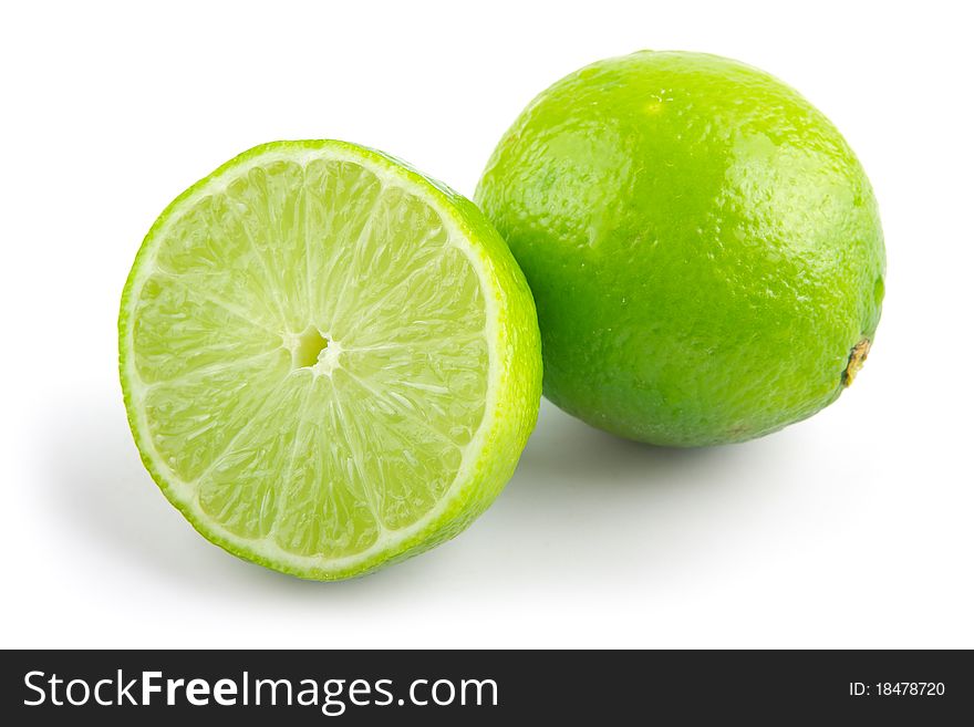 Fresh green limes on a white background