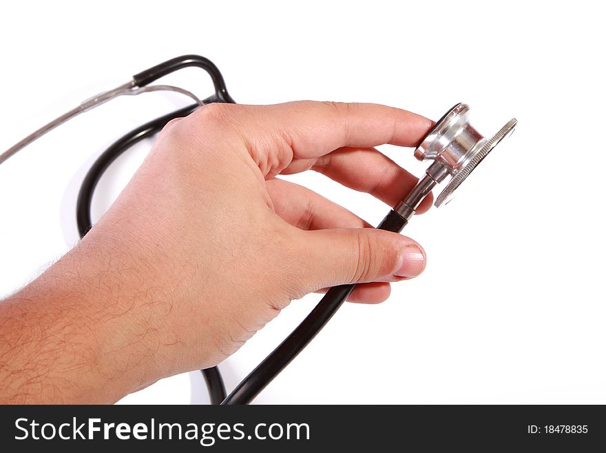 Doctor with an stethoscope in his hand at a hospital room