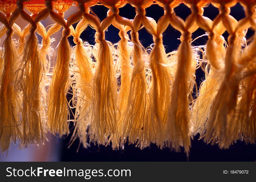 Curtain with tassel in the backlight.